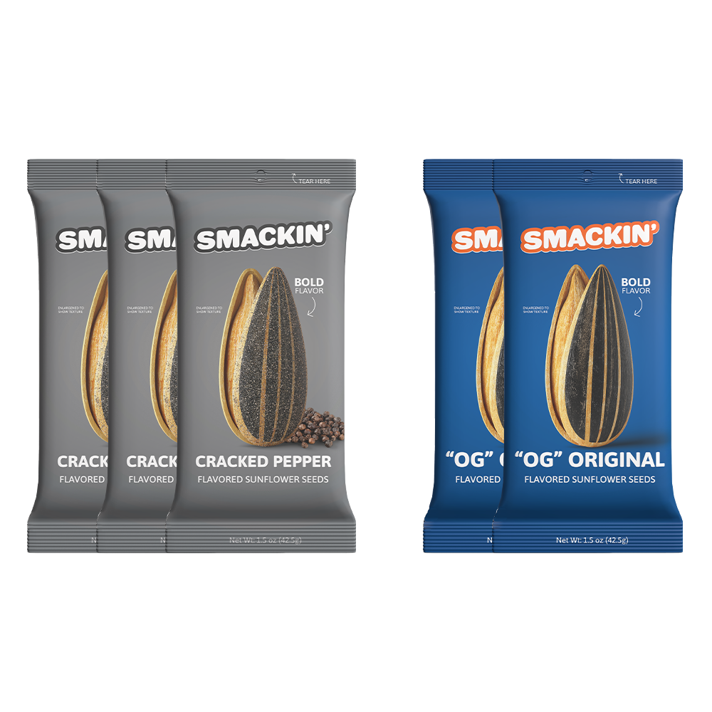 Product image displaying three grey Smackin Cracked Pepper flavored sunflower seed bags with peppercorns and two blue Smackin OG Original flavored sunflower seed bags, all prominently featuring a large sunflower seed illustration and 'Bold Flavor' text on 1.5 oz packaging