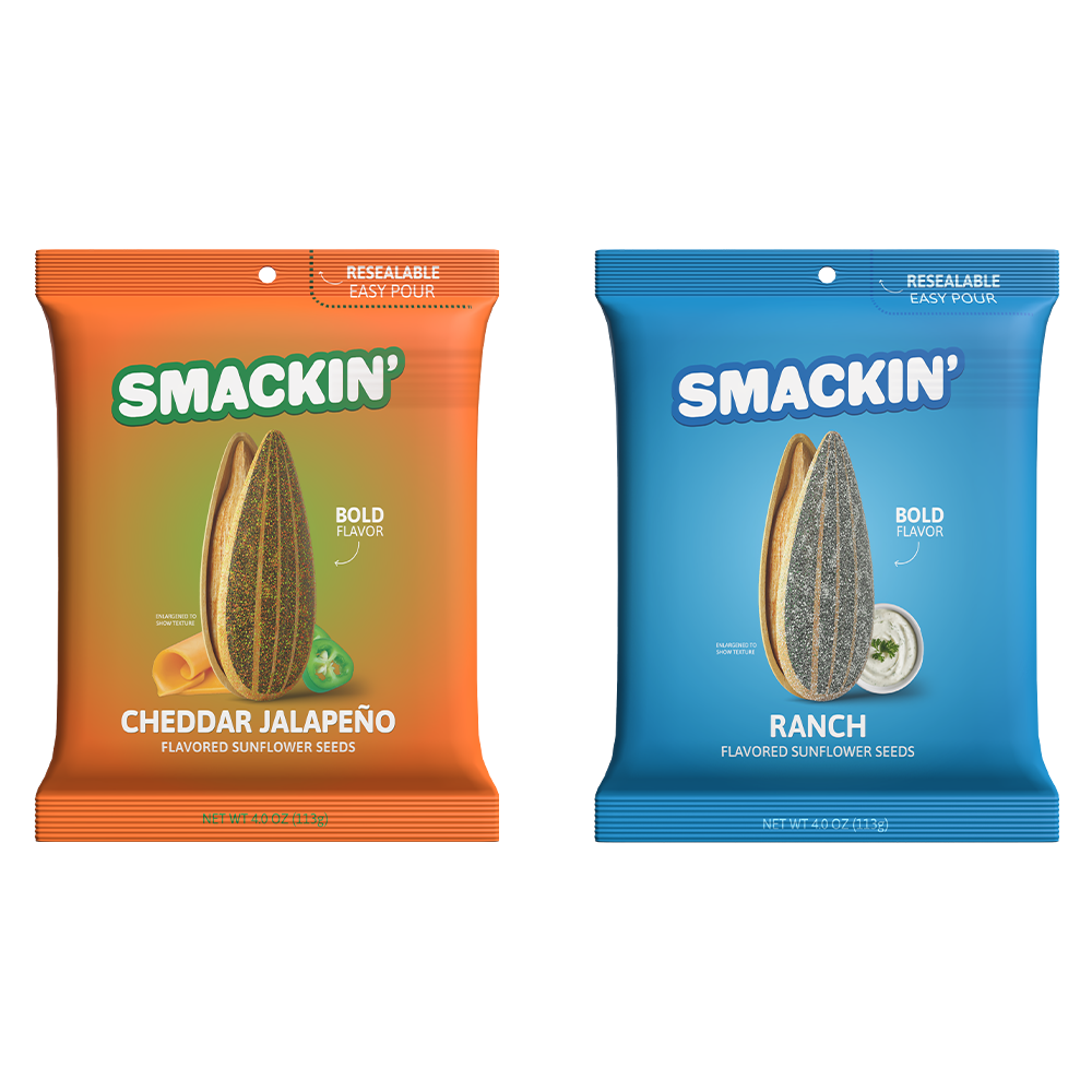 Two Smackin' flavored sunflower seed bags, one vibrant orange Cheddar Jalapeño showing a cheese curl and green jalapeño slices, and one bright blue Ranch showing a small bowl of creamy ranch dip, each prominently featuring a single sunflower seed and bold flavor claim