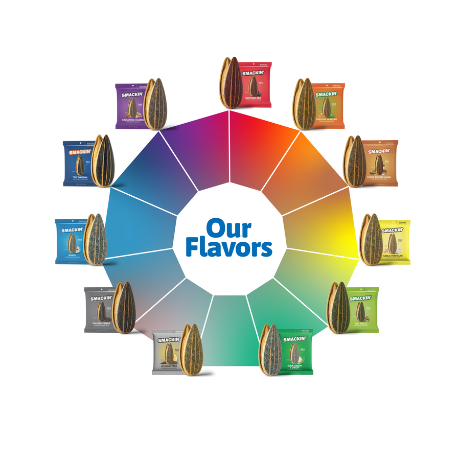 Product photography featuring Smackin' flavored sunflower seeds in colorful packaging arranged on a vibrant color wheel around "Our Flavors" text, highlighting varieties like Backyard BBQ, Dill Pickle, and Cinnamon Churro