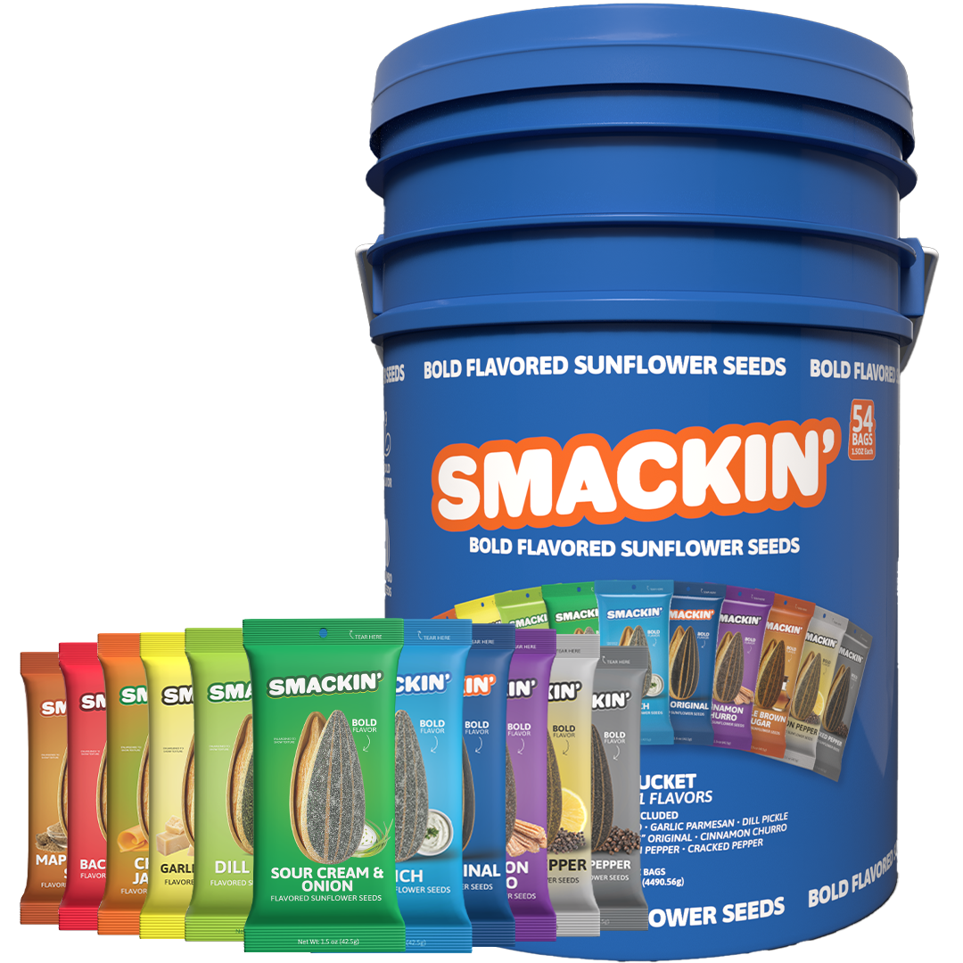 A tall blue Smackin' Bold Flavored Sunflower Seeds bucket displaying '54 BAGS' with a vibrant fan of individual colorful flavor packets including Sour Cream & Onion, Dill Pickle, and Maple Bacon