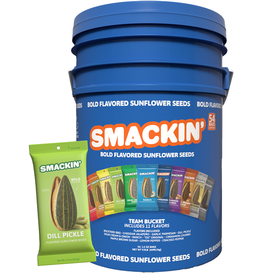 A large blue SMACKIN' Bold Flavored Sunflower Seeds team bucket with a vibrant orange logo is displayed alongside a prominent lime green Dill Pickle flavored pouch, showcasing 11 unique flavors like Backyard BBQ, Ranch, and Maple Brown Sugar
