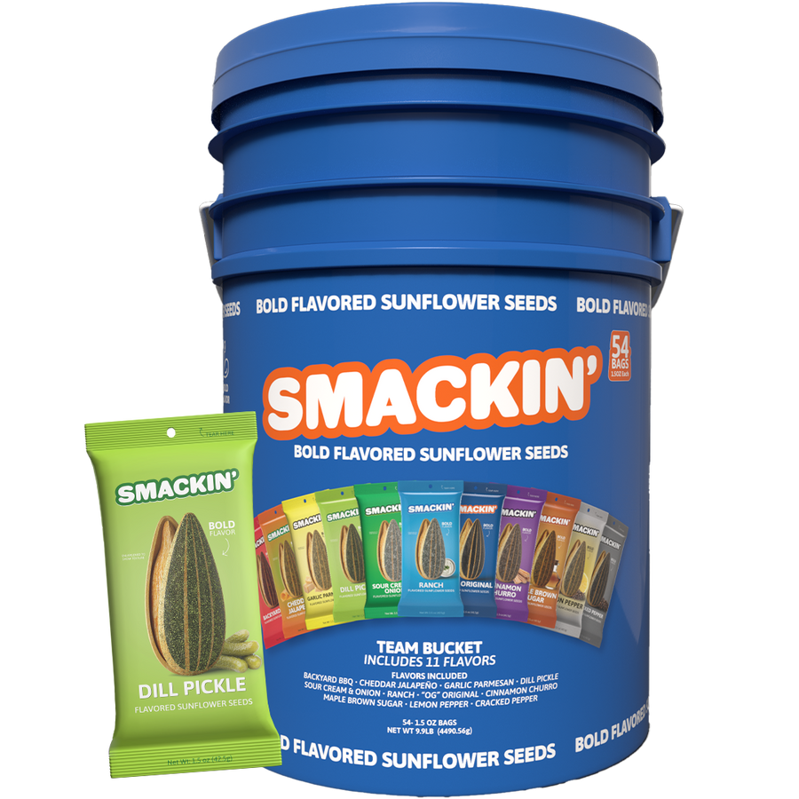 A large blue SMACKIN' Bold Flavored Sunflower Seeds team bucket with a vibrant orange logo is displayed alongside a prominent lime green Dill Pickle flavored pouch, showcasing 11 unique flavors like Backyard BBQ, Ranch, and Maple Brown Sugar