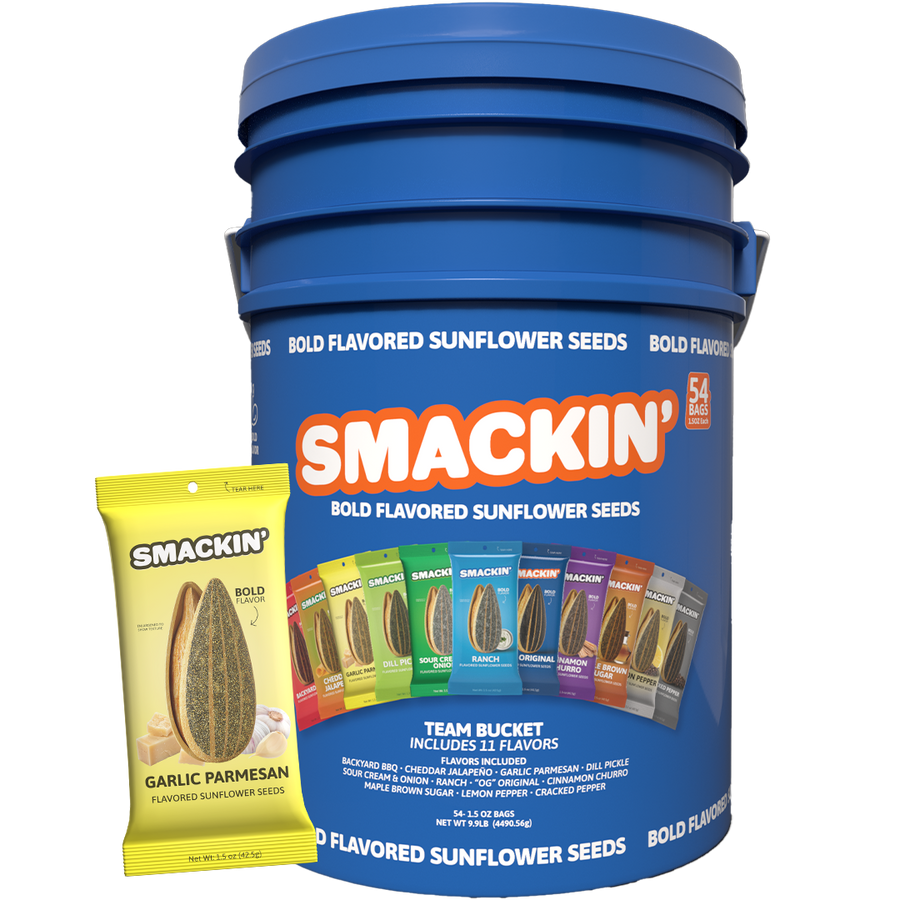 A large blue Smackin' Bold Flavored Sunflower Seeds Team Bucket showcasing 54 bags and 11 unique flavors including Garlic Parmesan, Dill Pickle, and Cinnamon Churro with a yellow Garlic Parmesan bag in front