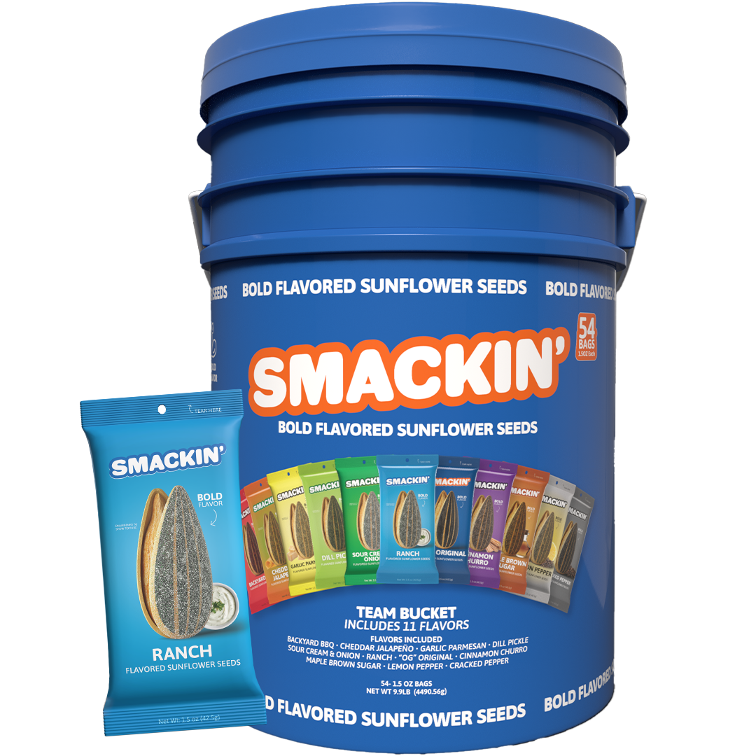 A large blue Smackin' Bold Flavored Sunflower Seeds Team Bucket with an orange and white logo, containing 54 individual bags of 11 diverse flavors including Ranch, Backyard BBQ, and Dill Pickle, presented with a smaller blue Ranch flavored bag