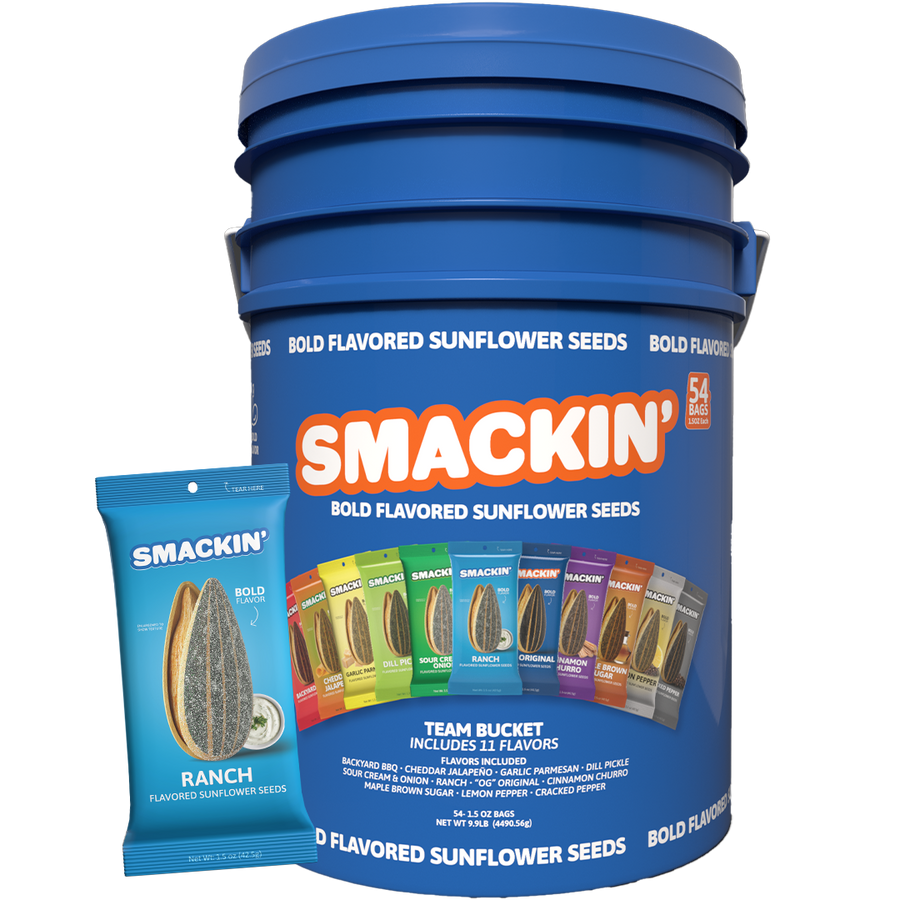 A large blue Smackin' Bold Flavored Sunflower Seeds Team Bucket with an orange and white logo, containing 54 individual bags of 11 diverse flavors including Ranch, Backyard BBQ, and Dill Pickle, presented with a smaller blue Ranch flavored bag