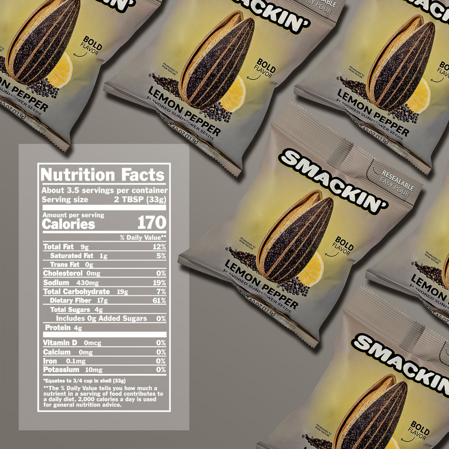 A flat lay product image of multiple Smackin' Lemon Pepper Flavored Sunflower Seeds packages in gray and yellow, featuring graphics of a cracked sunflower seed, a bright lemon slice, and black peppercorns, with a clear nutrition facts label detailing 170 calories and 430mg sodium