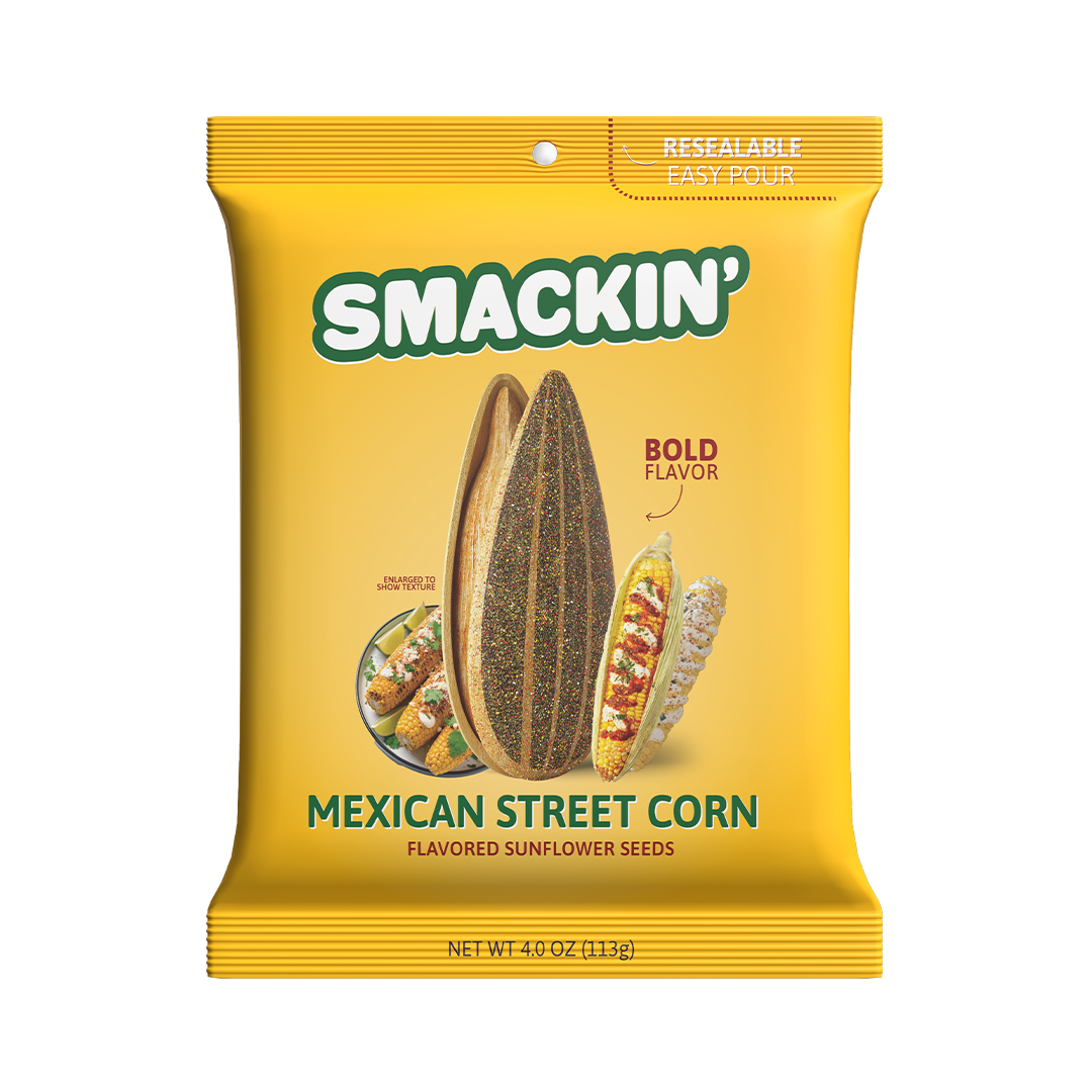 Product image of Smackin' Mexican Street Corn Flavored Sunflower Seeds in a bright yellow resealable bag, featuring a large split sunflower seed and three elote-style corn cobs with crema, chili, and cilantro for a bold flavor