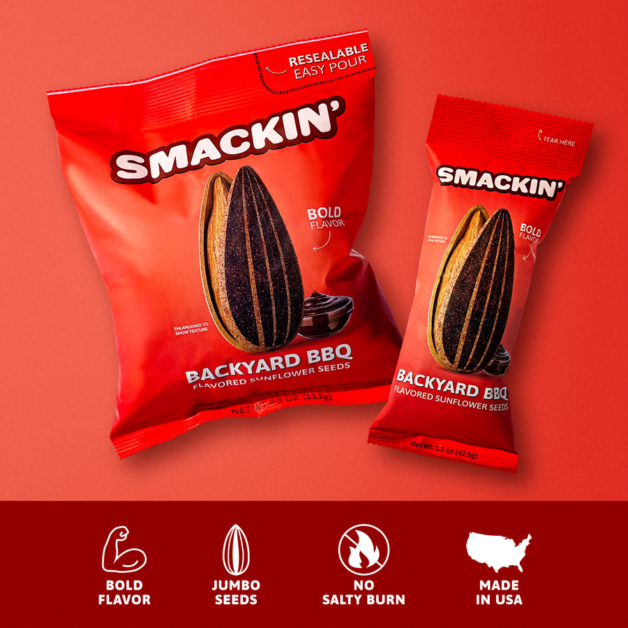 Digital photograph of two red Smackin' Backyard BBQ flavored sunflower seed bags, one 4.0 oz and one 1.5 oz, featuring enlarged black-striped seeds and a dollop of BBQ sauce, highlighted with Resealable Easy Pour and a Made in USA icon on a vibrant red background