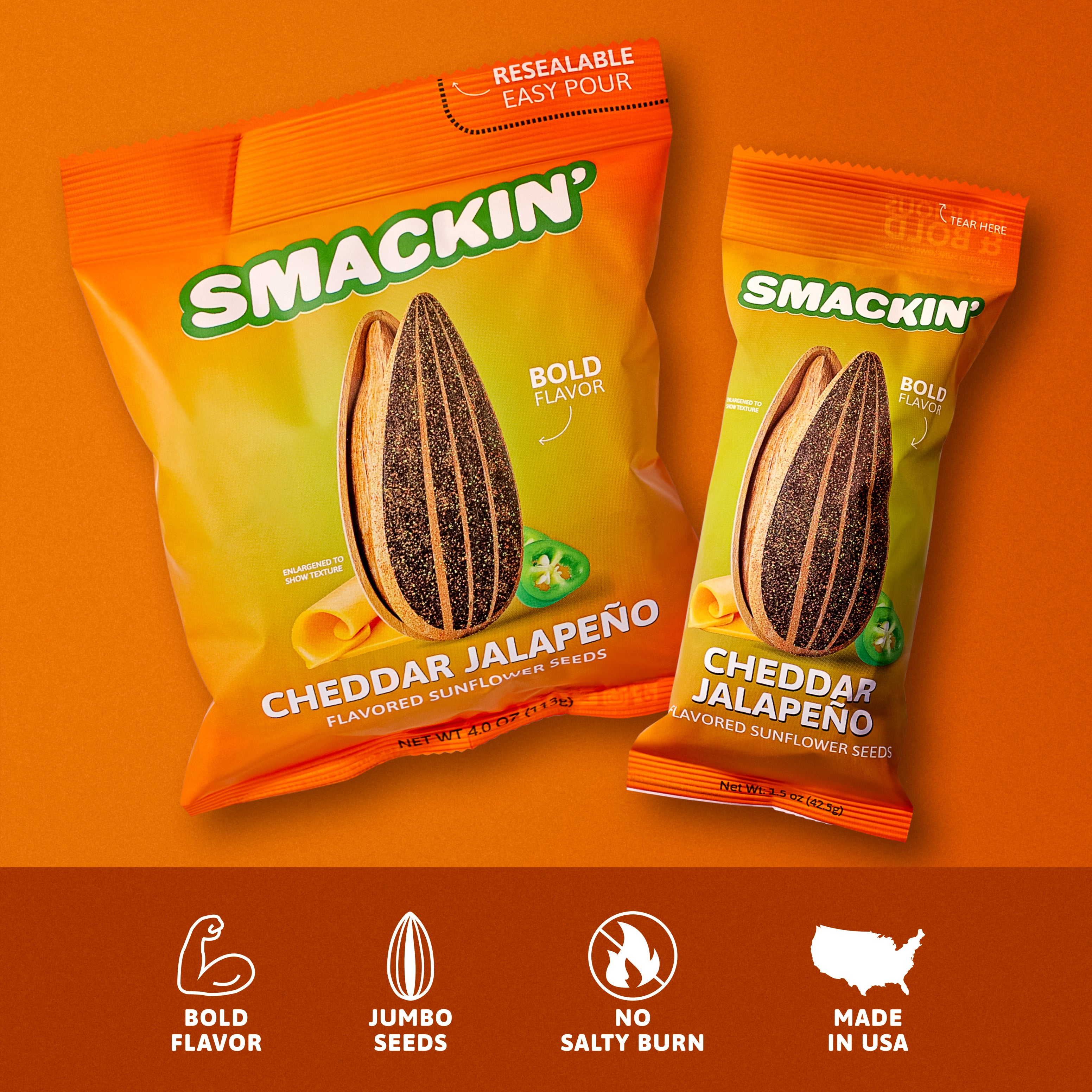 Two Smackin' Cheddar Jalapeño Flavored Sunflower Seeds bags, one large with Resealable Easy Pour and one smaller, sit against an orange background showcasing vibrant orange and yellow packaging, a prominent striped sunflower seed, bright cheddar curls, and green jalapeño slices